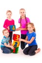 Happy kids holding blocks with numbers over white background Royalty Free Stock Photo