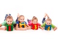 Happy kids holding blocks with numbers over white background Royalty Free Stock Photo