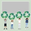 Happy kids holding recycle icons Royalty Free Stock Photo