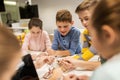 Happy kids with invention kit at robotics school Royalty Free Stock Photo