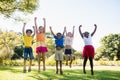 Happy kids jumping together during a sunny day Royalty Free Stock Photo