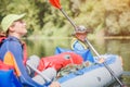 Happy kids kayaking on the river on a sunny day during summer vacation Royalty Free Stock Photo