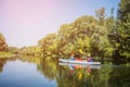 Happy kids kayaking on the river on a sunny day during summer vacation Royalty Free Stock Photo