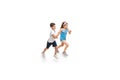 Happy little caucasian girl and boy jumping and running isolated on white background Royalty Free Stock Photo