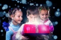 Happy kids open a magic present box Royalty Free Stock Photo