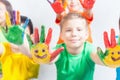 Happy kids with painted hands. International Children's Day Royalty Free Stock Photo