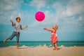 Kids play with ball on beach, boy and girl have fun at sea Royalty Free Stock Photo