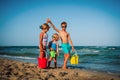 Happy kids play on beach, boy and girls have fun at sea Royalty Free Stock Photo