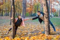 Happy kids play in sunny autumn park. Life style, golden hour background