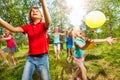 Happy kids playing balloons outdoor in summer