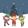 Happy kids playing near the Christmas tree under the snow Royalty Free Stock Photo