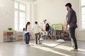Happy kids playing soccer together with parents in living room in their spacious apartment Royalty Free Stock Photo