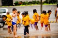 Happy kids playing in the water fountain