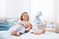 Kids playing in white bedroom Royalty Free Stock Photo