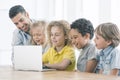 Happy kids programming on laptop Royalty Free Stock Photo