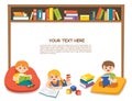 Happy kids read book and study together with multi colored bookshelf in library.