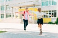 Happy kids are ready for elementary school, Happy classmates Boy and girl greet each other after quarantine, in the backyard Royalty Free Stock Photo