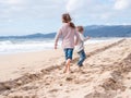 Happy kids running on the beach on vacation Royalty Free Stock Photo