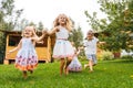 Happy kids running in garden on grass Royalty Free Stock Photo