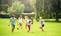 Happy kids running and playing game outdoors Royalty Free Stock Photo