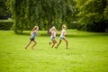 Happy kids running and playing game outdoors Royalty Free Stock Photo
