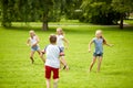 Happy kids running and playing game outdoors Royalty Free Stock Photo