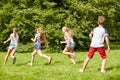 Happy kids running and playing game outdoors Royalty Free Stock Photo