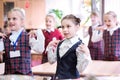 Happy kids in school class. Children have doing exercises. Primary School