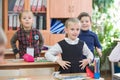 Happy kids in school class. Children have doing exercises. Primary School