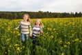 Happy kids sisters running around laughing in