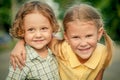 Happy kids sitting on the road. Concept Brother And Sister Together Forever