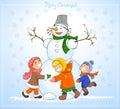 Happy kids and snowman celebrate Christmas.