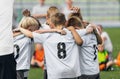 Happy kids in sports team dancing and celebrating school championship