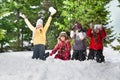 Happy kids standing on knees at sunny winter day Royalty Free Stock Photo