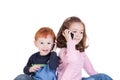 Happy kids talking on mobile phones