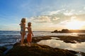 Happy kids walk with fun by sunset sea beach