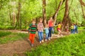 Happy kids walking together holding hands in park Royalty Free Stock Photo