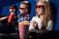 Happy kids watching movie in 3d glasses in cinema. Royalty Free Stock Photo