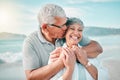 Happy, kiss or old couple laughing on beach with love, care or support on summer vacation in nature. Retirement, mature Royalty Free Stock Photo