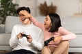 Happy Korean Boyfriend And Girlfriend Playing Video Games At Home Royalty Free Stock Photo