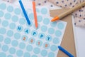 `Happy 2018` label on paper sticker with pen and candle on wooden table Royalty Free Stock Photo