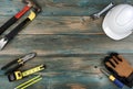 Happy Labor Day background with construction work tools in each corner of faded blue wood planks Royalty Free Stock Photo