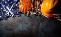 Happy Labor day concept. American flag with different construction tools on dark stone background, with copy space for text Royalty Free Stock Photo