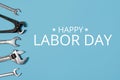 Happy labor day concept. Banner with Different wrenches on blue background