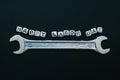 Happy labor day concept greeting card background. Wrench with word happy labour day on blackboard background.