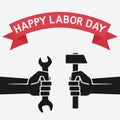 Happy labor day concept. Hands holding hammer and wrench on vintage background Royalty Free Stock Photo