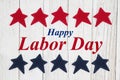 Happy Labor Day text with patriotic red and blue stars