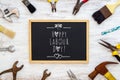 Happy Labour Day background concept. Rusty old hand tools with blackboard and text writing Happy Labour day