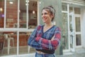 Happy lady in cropped cardigan standing near cafe Royalty Free Stock Photo