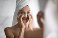 Happy lady enjoying domestic skincare morning routine. Royalty Free Stock Photo